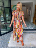 IT FALLS INTO PLACE SMOCKED MIDI DRESS