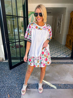 Woman wearing sporty, edgy floral skort. Perfect for moms running errands or carpooling. Pair with matching top or any tee.