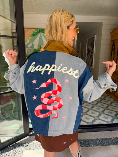 A woman models a color-block utility jacket with denim and green colorblocking. Wear this jacket to round top, a rodeo, or running around town. The best  lightweight, casual fall layer. A must have for busy chic moms on the go.