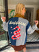 A woman models a color-block utility jacket with denim and green colorblocking. Wear this jacket to round top, a rodeo, or running around town. The best  lightweight, casual fall layer. A must have for busy chic moms on the go.