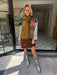A woman models a color-block utility jacket with denim and green colorblocking. Wear this jacket to round top, a rodeo, or running around town. The best  lightweight, casual fall layer. A must have for busy chic moms on the go.