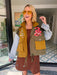 A woman models a color-block utility jacket with denim and green colorblocking. Wear this jacket to round top, a rodeo, or running around town. The best  lightweight, casual fall layer. A must have for busy chic moms on the go.