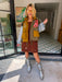 A woman models a color-block utility jacket with denim and green colorblocking. Wear this jacket to round top, a rodeo, or running around town. The best  lightweight, casual fall layer. A must have for busy chic moms on the go.