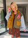 A woman models a color-block utility jacket with denim and green colorblocking. Wear this jacket to round top, a rodeo, or running around town. The best  lightweight, casual fall layer. A must have for busy chic moms on the go.